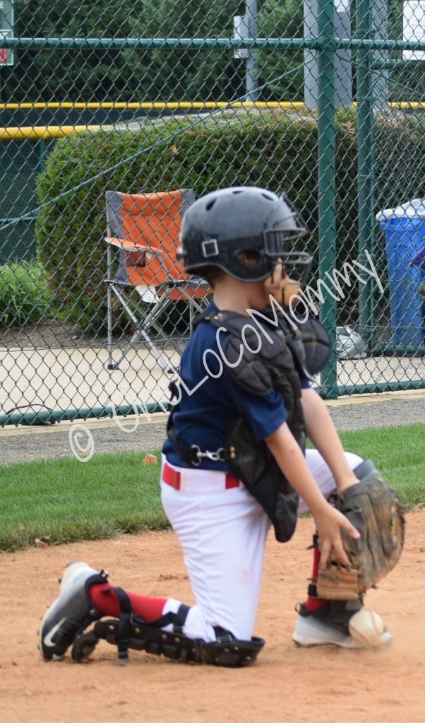 Image Posted: B playing catcher. At first it was ok, but one time he fell forward, got yelled at, and now doesn't like it. Oh well.